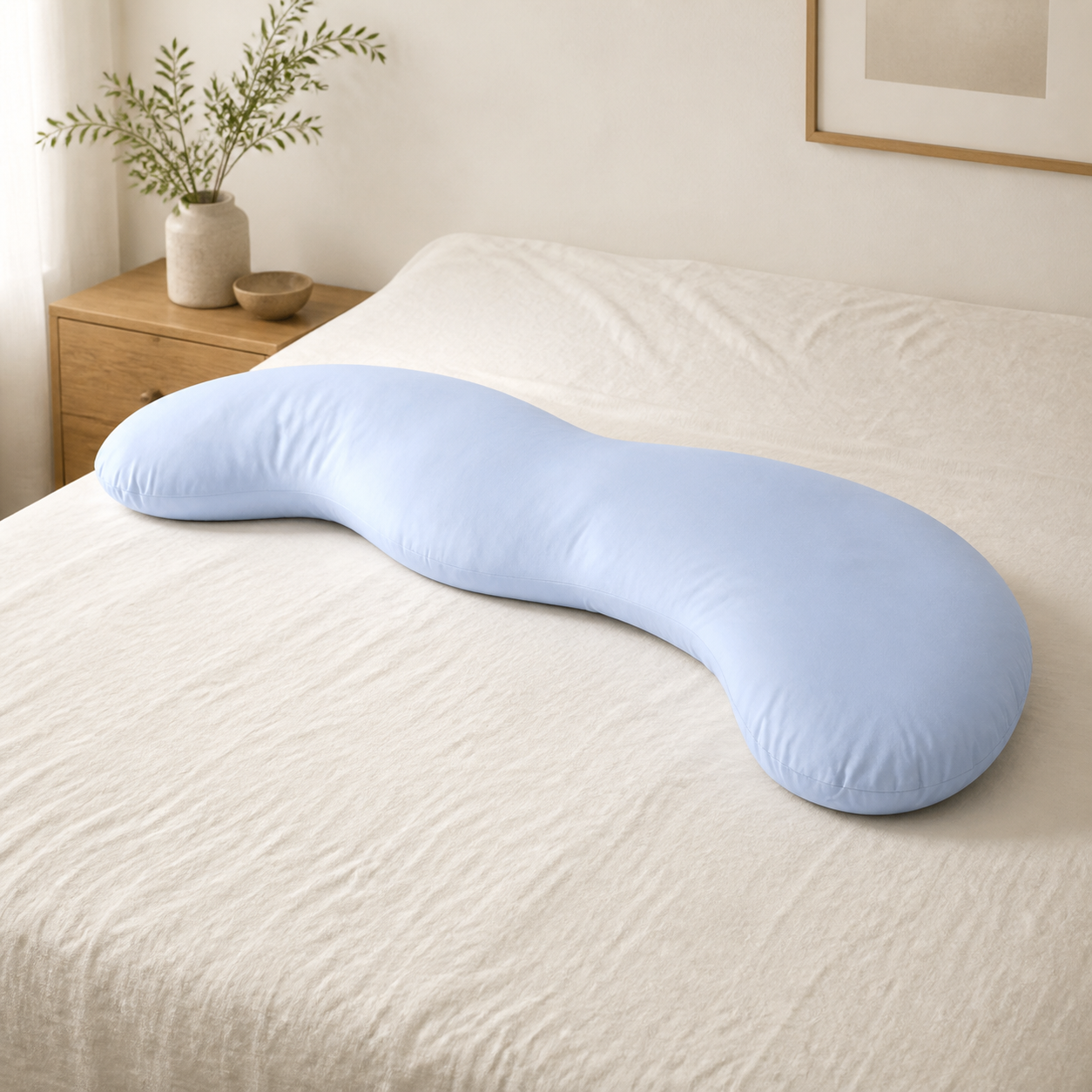 Cloud Blue Pea Pod body pillow on a bed